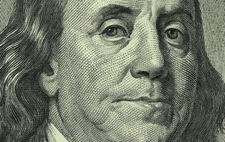 portrait of Benjamin Franklin on the hundred dollar bill closeup