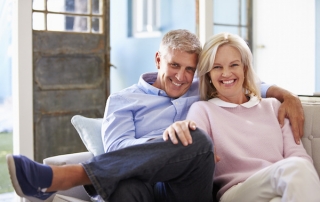 Mature couple smiling, tax planning with France Law Firm