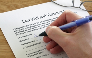 Signing Last Will and Testament document